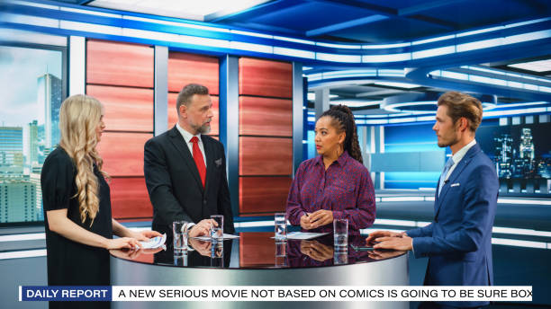 istock Talk Show TV Program: Four Diverse Specialists, Experts, Guests, Presenter, Host Discuss and Argue about Politics, Economy, Science, News. Mock-up Television Cable Channel Studio Debate 1407703057