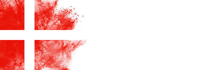 Abstract exploding powder in colors of Danish flag, isolated on white background with lot of copy space.