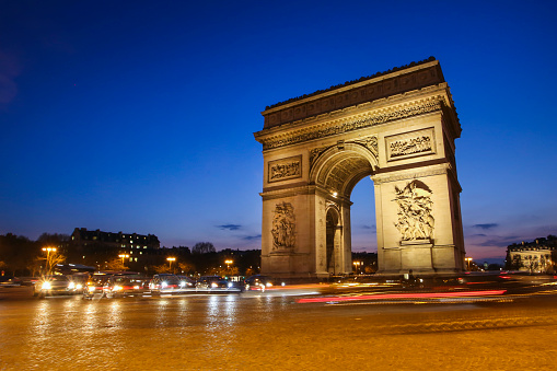 Arc de Triomphe on The Place Charles de Gaulle at night in Paris, France.