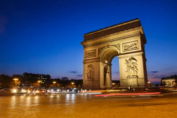 Arc de Triomphe on The Place Charles de Gaulle at night in Paris, France.