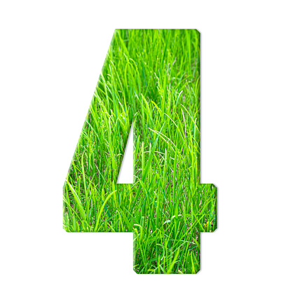 Four with the texture of green juicy grass isolated on a white background. Numbers. Close-up.