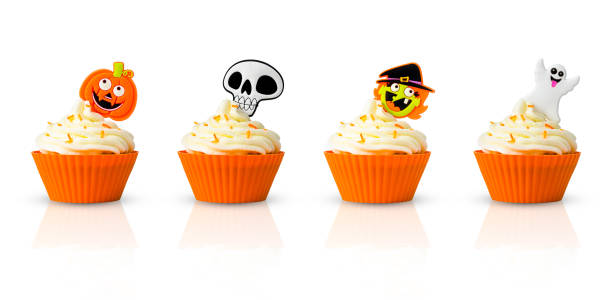 Variety of Halloween cupcakes isolated on white background Variety of Halloween cupcakes isolated on white background. halloween cupcake stock pictures, royalty-free photos & images