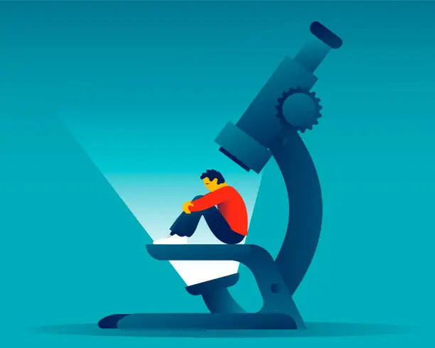 Vector illustration of Depressed man sitting under a microscope