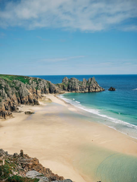 istock Views over Pedn Vounder Beach, Cornwall at low tide on a summer afternoon 1407709752