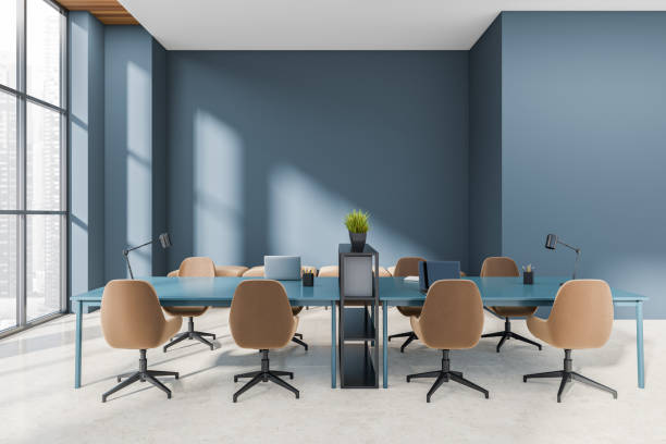 istock Office interior with laptop on desk, panoramic window on city view 1407709775
