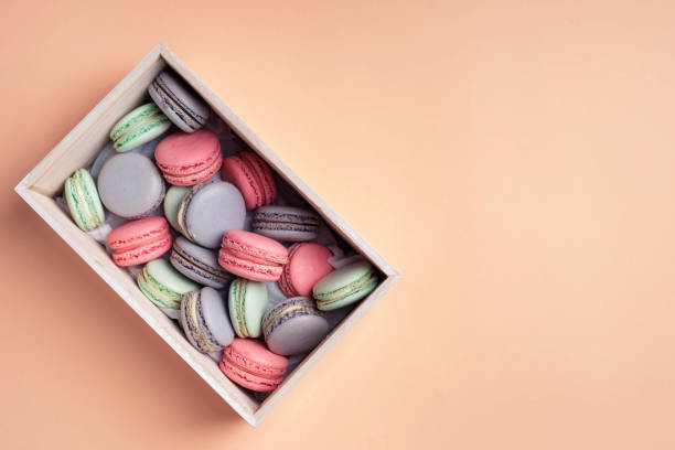 istock Pink, lilac and mint macaron cookies in the box. 1407710385