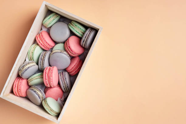 istock Pink, lilac and mint macaron cookies in the box. 1407710394