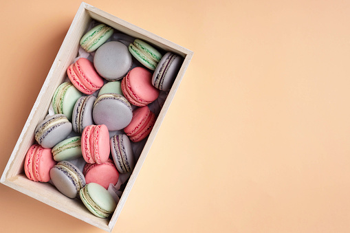 Pink, lilac and mint macaron cookies in the box.