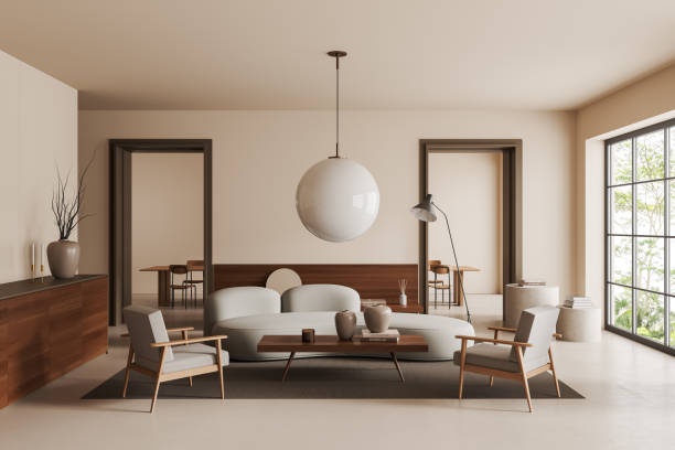 istock Light living room interior with couch and decoration, dining area and mockup frame 1407710576