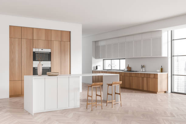 istock Light kitchen interior with island and seats, appliances and panoramic window 1407711001