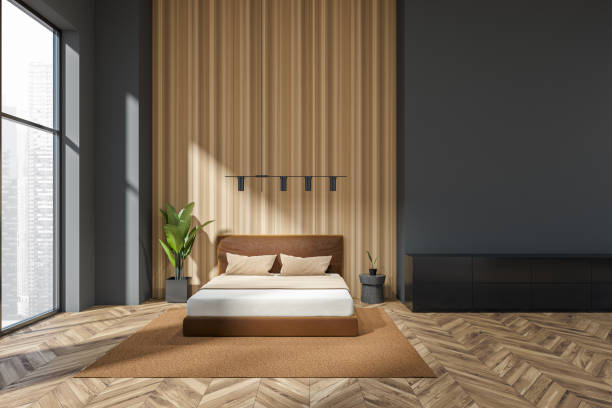 istock Modern bedroom interior with bed near panoramic window on city view 1407711236