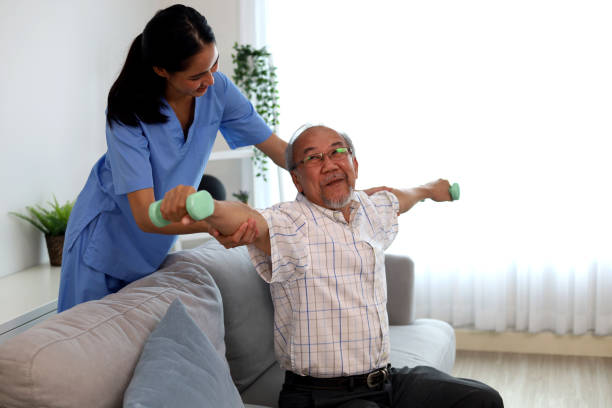 istock Happiness senior man physical therapy with a nurse. 1407713935