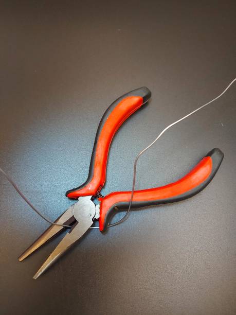 istock The wire cutters on the background. 1407714925