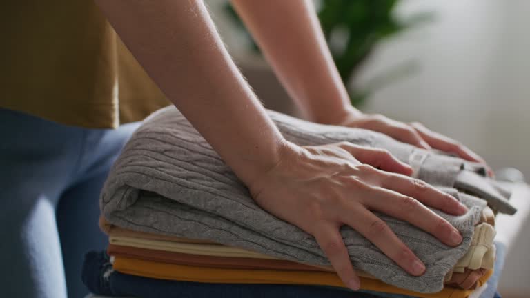 Woman folding laundry