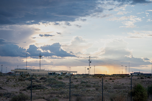 United States/Mexico Border Control Crossing at Santa Teresa New Mexico at Dusk Under a Dramatic Cloudscape in the Summer