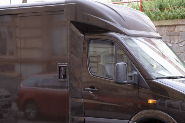 istock Parcel delivering Service car parked on the street in EU 1407718561