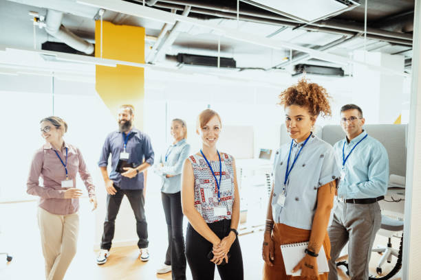istock Multiracial business team working together in office, standing and looking at camera 1407718792