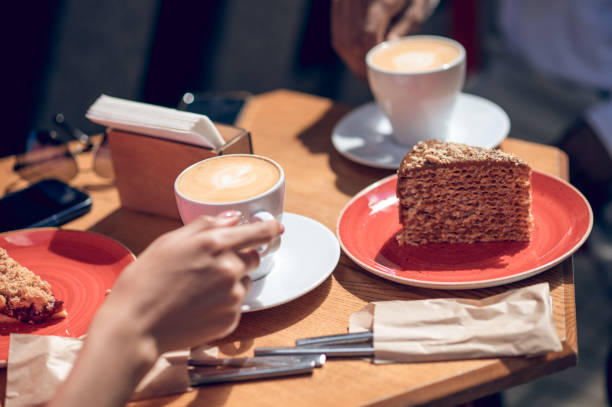 Street cafe. Close up ogf a table with coffee and desert
