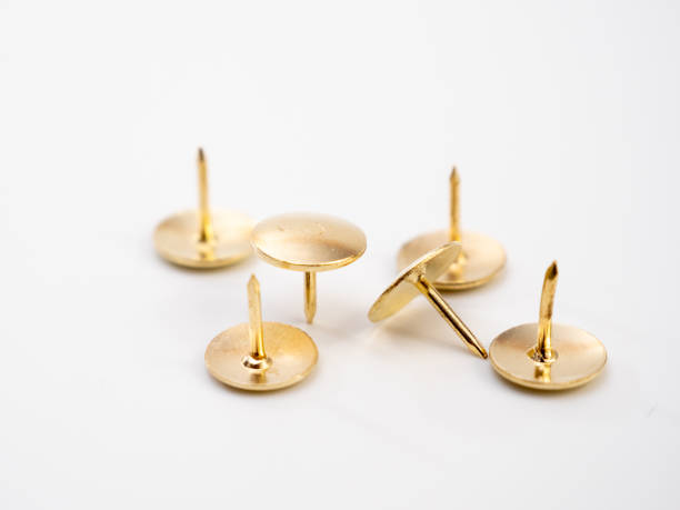 istock Set of golden thumbtacks. 1407720061
