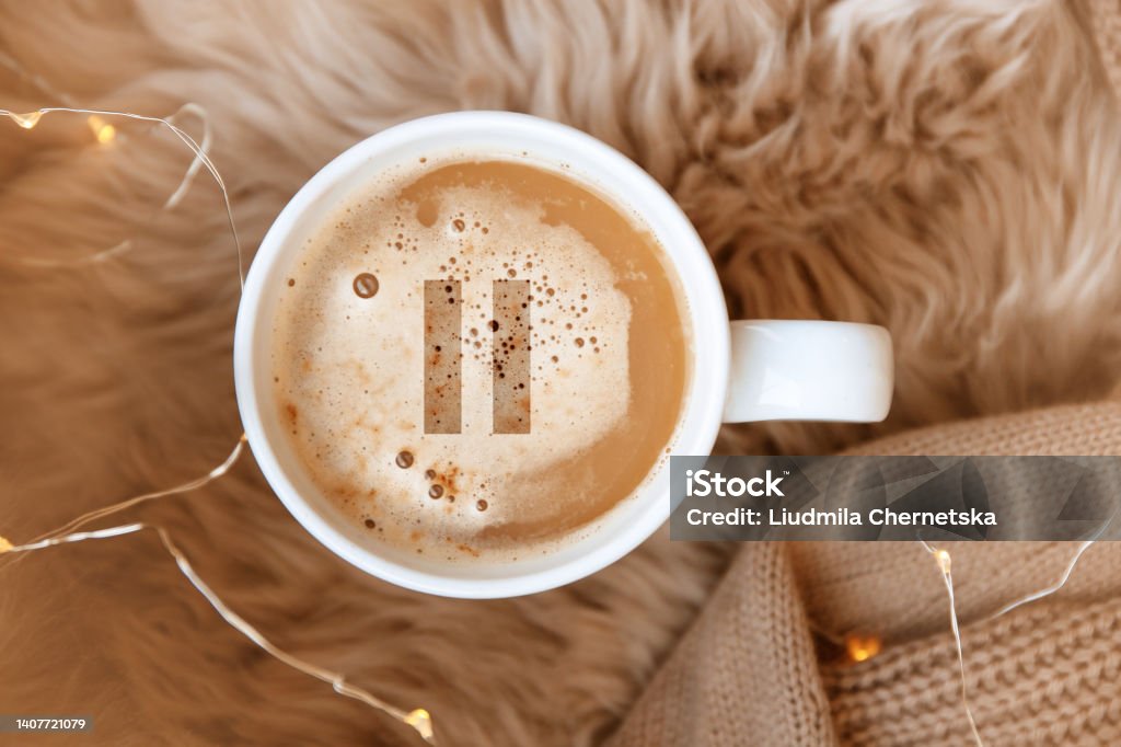 Coffee Break. Cup of aromatic americano with milk on faux fur, top view Artificial Stock Photo
