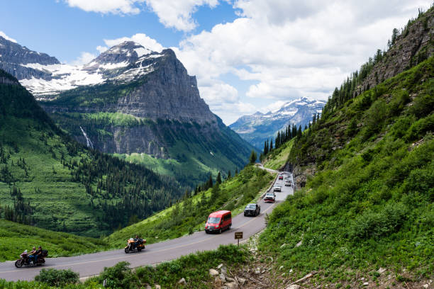 Cars driving the crowded Going-to-the-Sun road on the 4th of July national holiday - Glacier National Park, USA stock photo