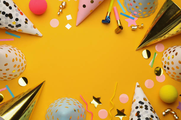 istock Flat lay composition with party hats and other festive items on orange background. Space for text 1407721519