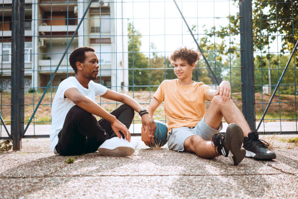 istock Friends relaxing after good basketball game 1407722253
