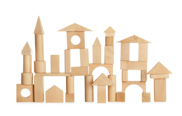 istock Building made of wooden blocks on white background 1407722563