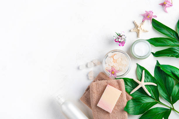 istock Spa elements, towel, soap, salt, cream and flowers on a white background. 1407722654