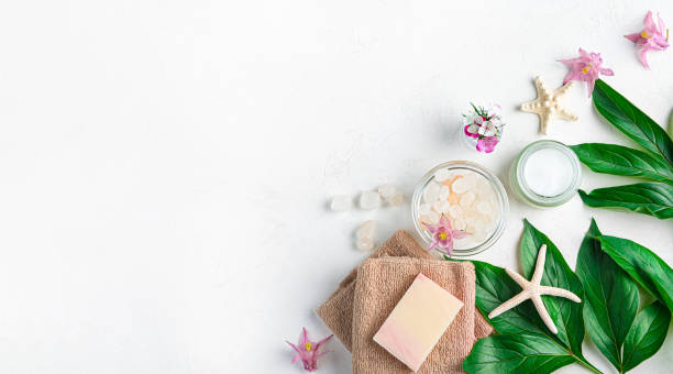 istock Spa composition with cream, soap, towel and salt on a white background. 1407723785