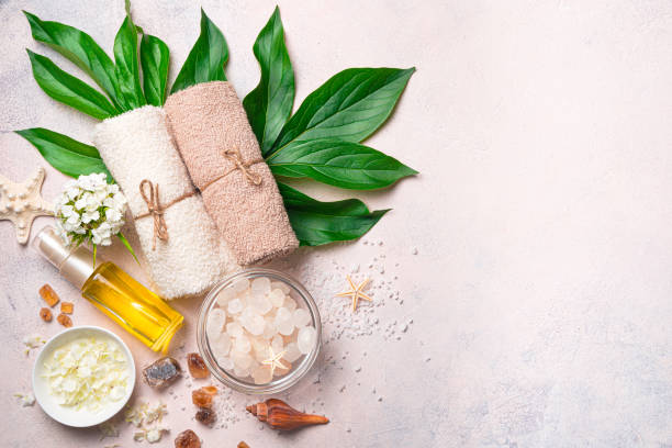 istock Spa composition with natural cosmetics and spa accessories on a light pink background. 1407724079