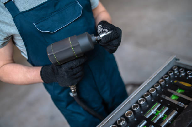 istock Close up picture of a technician with a tool in hands 1407725024