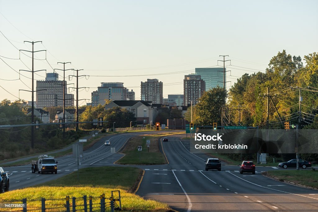 Reston, northern Virginia town center office building architecture in sunrise morning view of cityscape skyline and street road with traffic light and cars Fairfax - Virginia Stock Photo