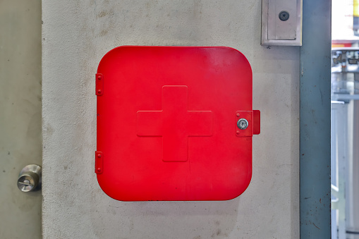 Red First aid box for safety reason at factory.