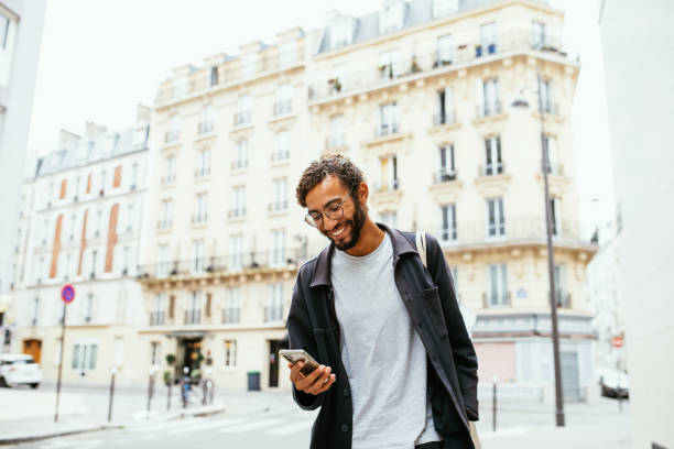 istock Portrait of handsome young multiracial man using smart phone 1407727265