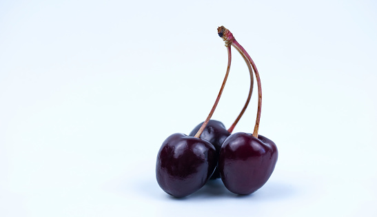 ripe cherries on a white background, macro photo, isolated