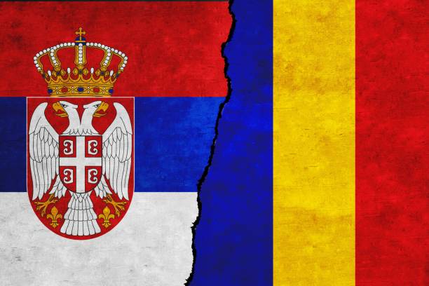 istock Serbia and Romania painted flags on a wall with a crack 1407730655