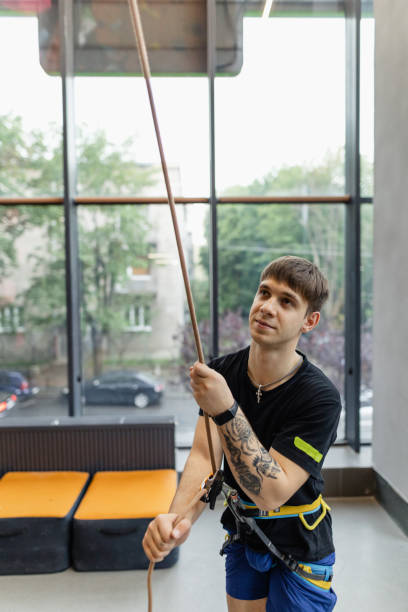 istock The man using safety harness for a climbing 1407730685