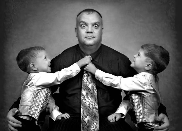 father and son playing with black and white shirts