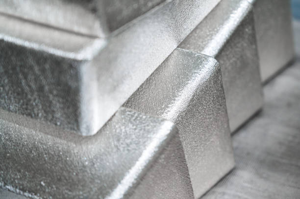 istock Stack of industrial silver ingots at bright light in storage 1407730798