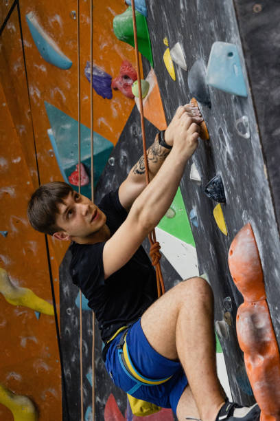 istock The man climbing on the climbing wall 1407730822