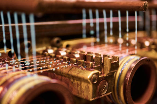 istock Cooling oil poured down on vintage coil winder machine tool 1407730833