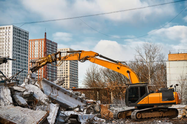 istock Excavator with hydraulic scissors cuts reinforced concrete 1407730856