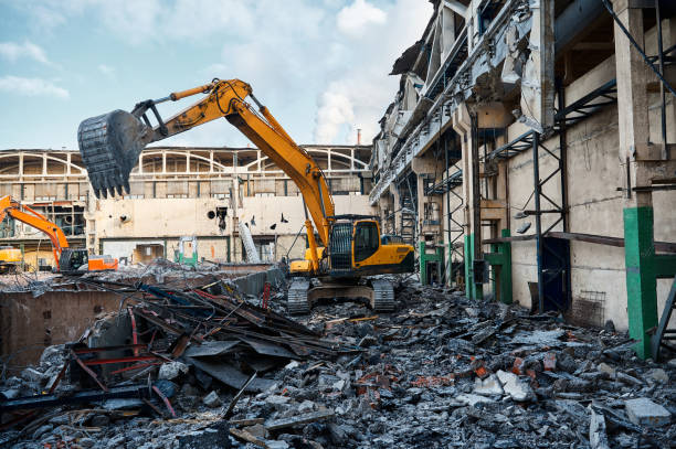 istock Hydraulic excavators at demolition site of industrial complex 1407730860