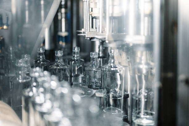 istock Row of glass bottles to fill with expensive alcohol drinks 1407730954