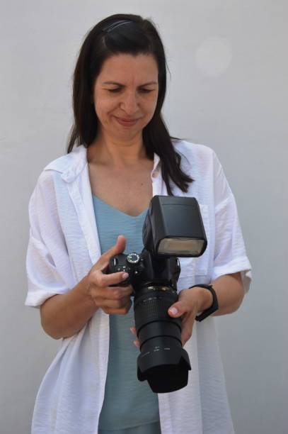 istock girl with a professional camera 1407731976