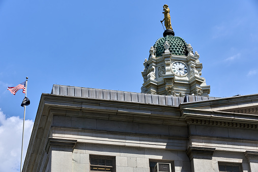 Brooklyn, NY - June 24, 2022: The cupola and statue of Justice sits above Brooklyn Borough Hall (1848), Brooklyn, NYC, originally City Hall of Brooklyn, built of marble in the Greek Revival style
