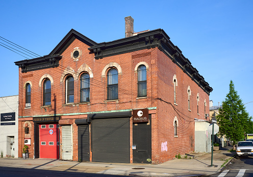 Brooklyn, NY - June 15, 2022: The Red Hook Firehouse (1872) is an Italianate style red brick building on Van Brunt St., originally part of the  Brooklyn Fire Department. It is now home to Friends of Firefighters