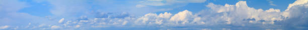 istock Blue sky landscape with white clouds, huge panorama. Horizontal banner 1407732987