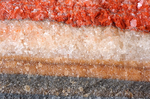 Colorful layered saline deposits close-up as background